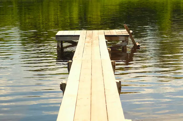 Crowded fishing pier with multiple anglers