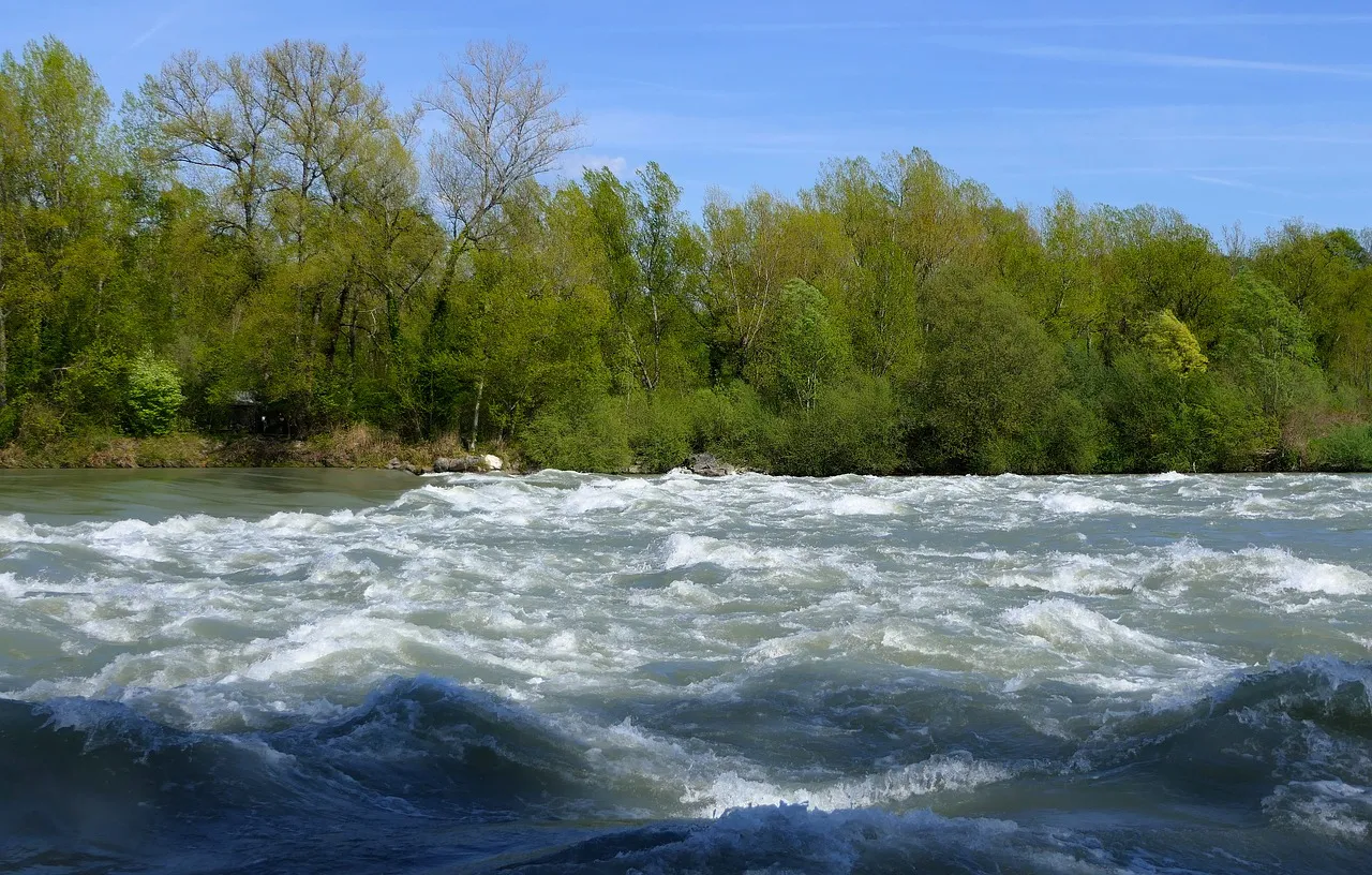 River showing visible current patterns and eddy formations where fish typically gather